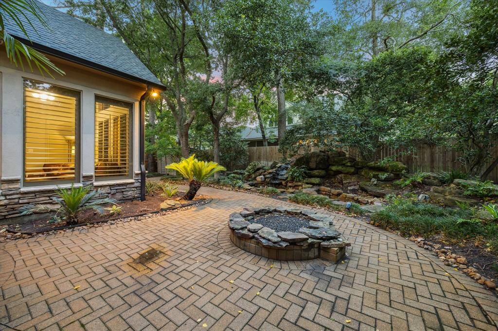 Back yard with fire pit and water feature