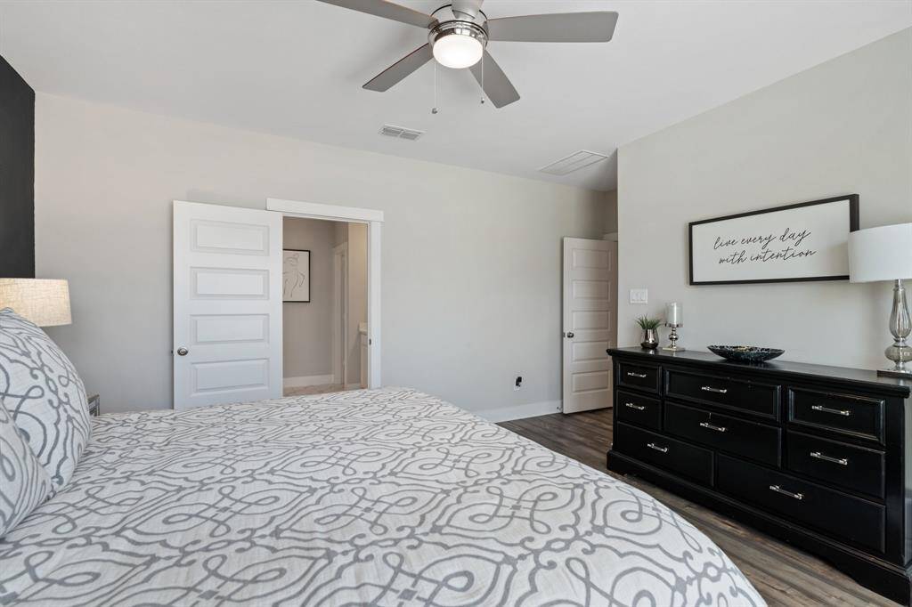 Another view into the the primary bedroom. The door leads to the ensuite bathroom.