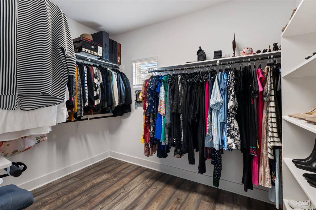 The primary suite also features a generously sized walk-in closet.