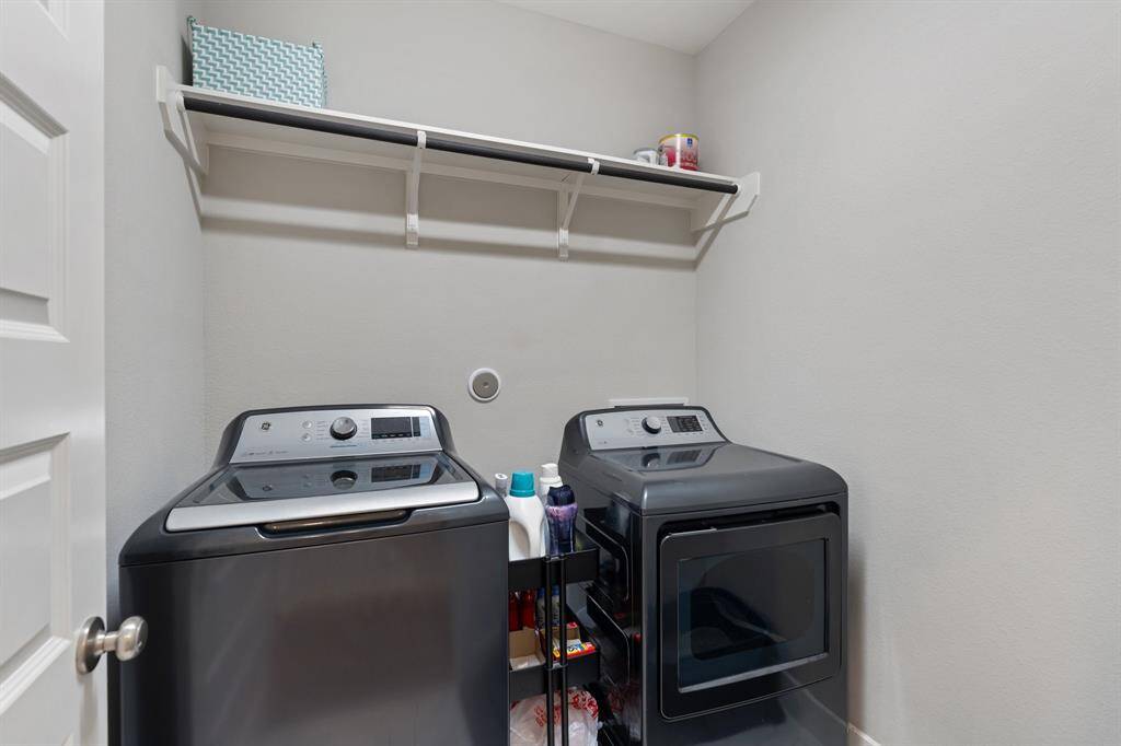 The laundry room is located on the second floor for added ease.