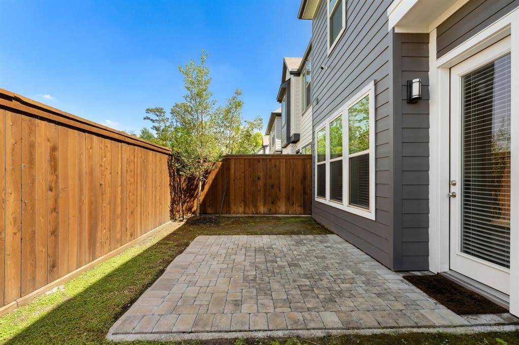 Outside of the living and kitchen areas you will find the fenced back yard and patio space.