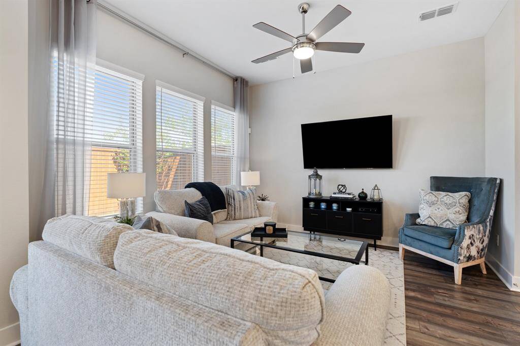 The space feels expansive with high ceilings and abundant natural light.