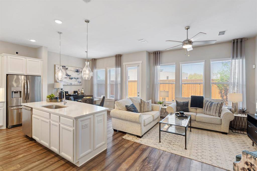The living area offers a perfect blend of comfort and style, while the kitchen serves as the heart of the home.