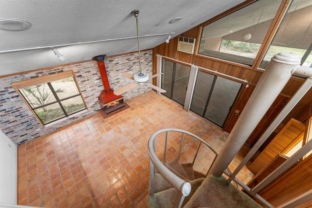 View of den and carport from top of reading nook.