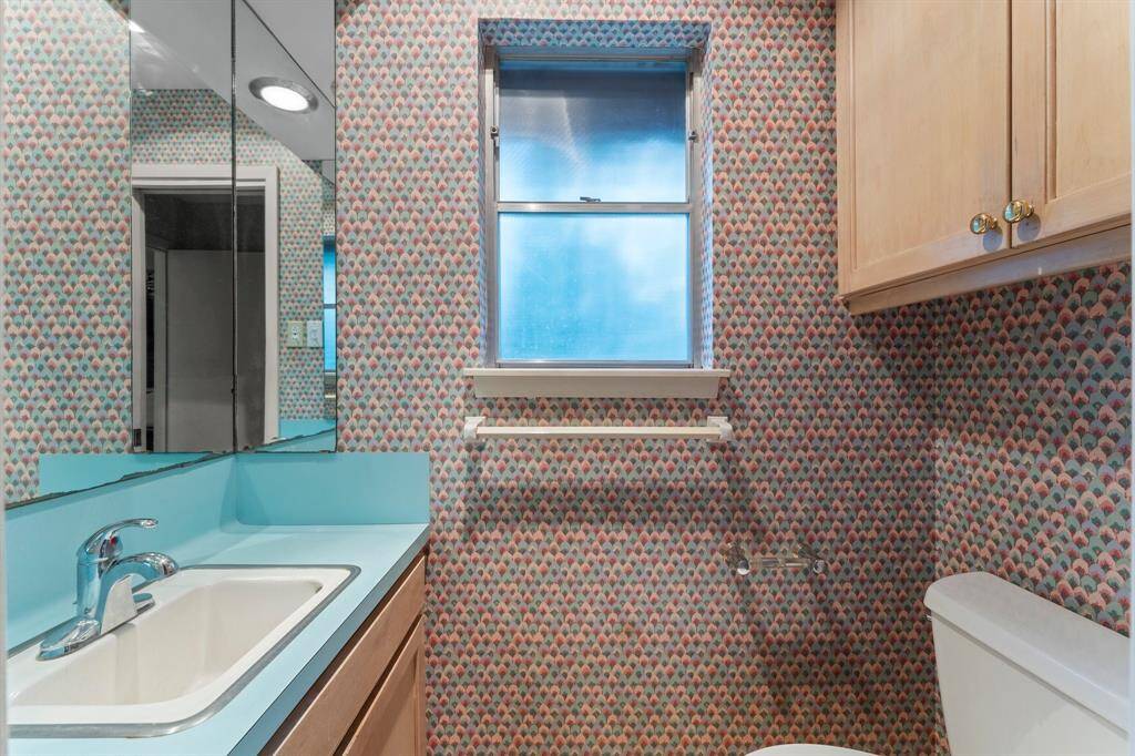 Half bath just off of den and near kitchen and laundry.