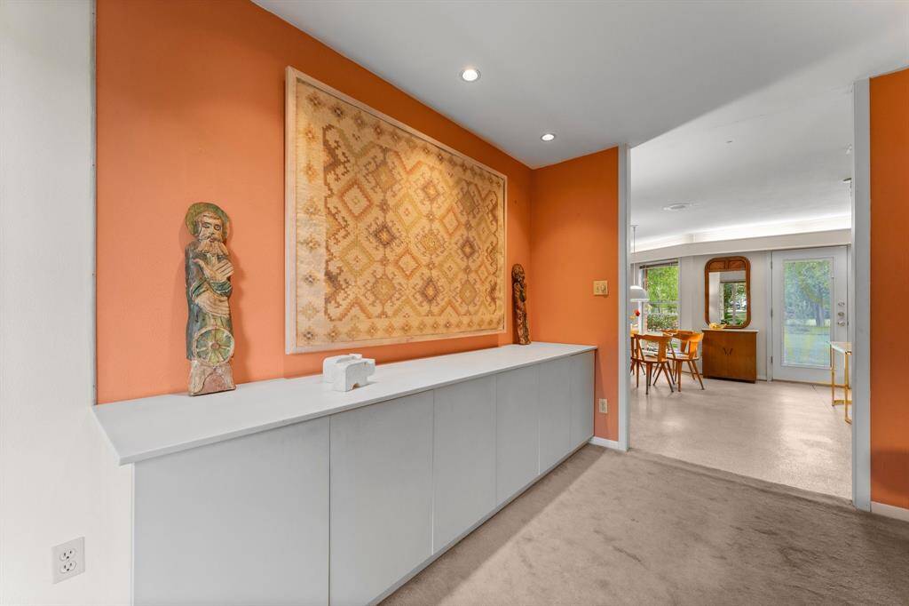 Dramatic dining room with sitting area just in front of kitchen.