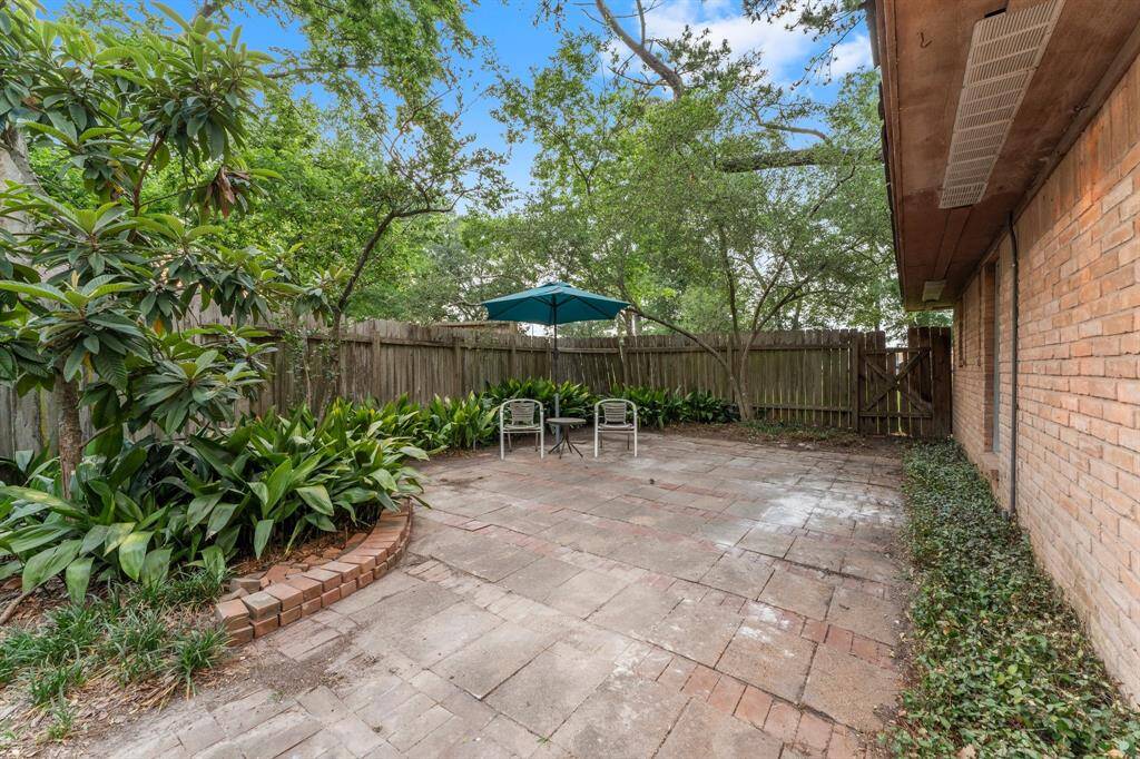 Primary bedroom private patio on far northwest fence line.