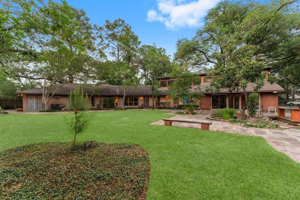 Expansive back yard with wraparound patio.