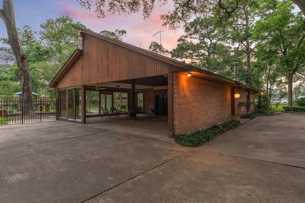 View of carport and back patio entrance from circle drive