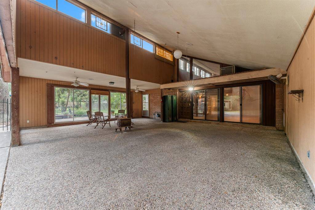 Expansive carport.  Sitting area with pot belly stove for cool nights.