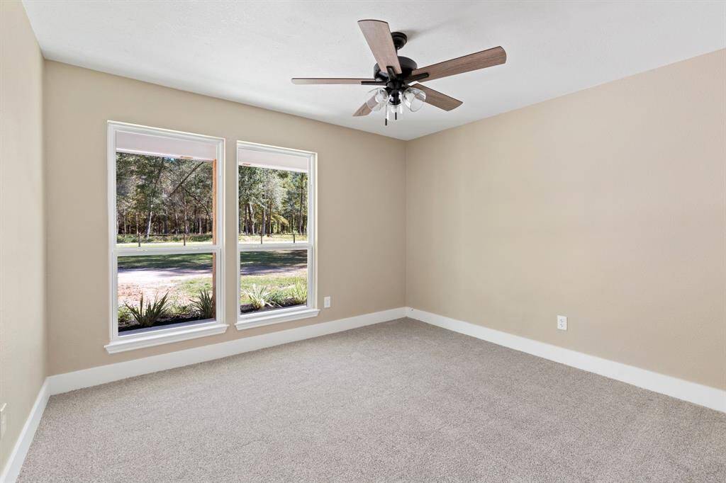 First floor room/flex space facing the front of the home.