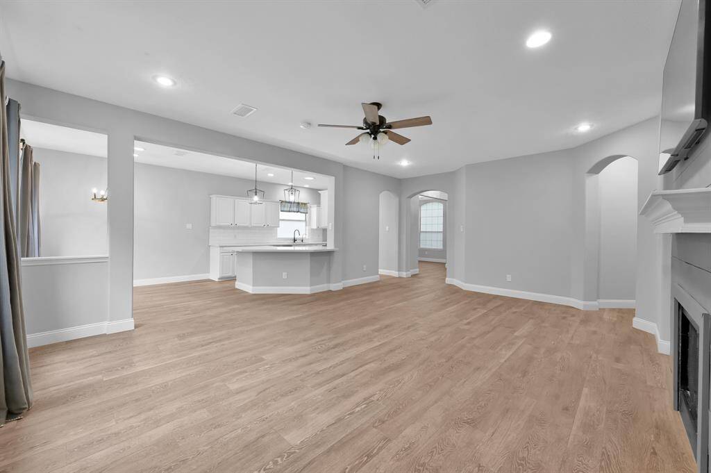 The living room opens to the kitchen and breakfast area for easy flow.