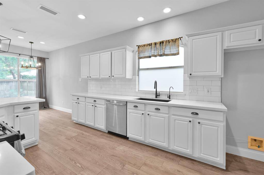 A large, deep sink, updated dishwasher, and reverse osmosis system are just a few of this kitchen’s standout features.