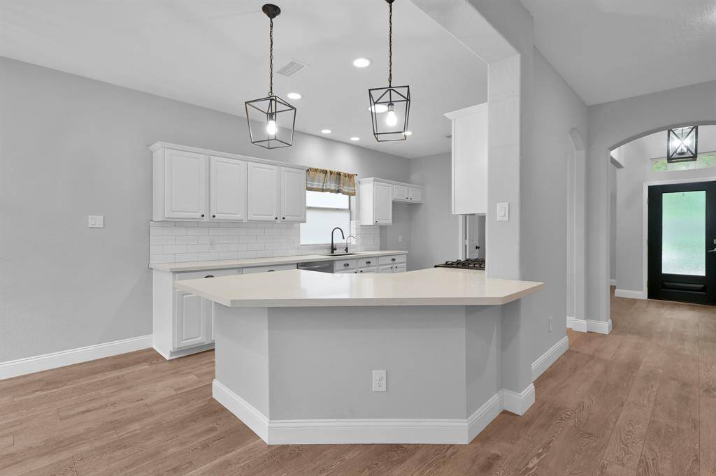 Spacious, level breakfast bar—perfect for gathering and casual dining.