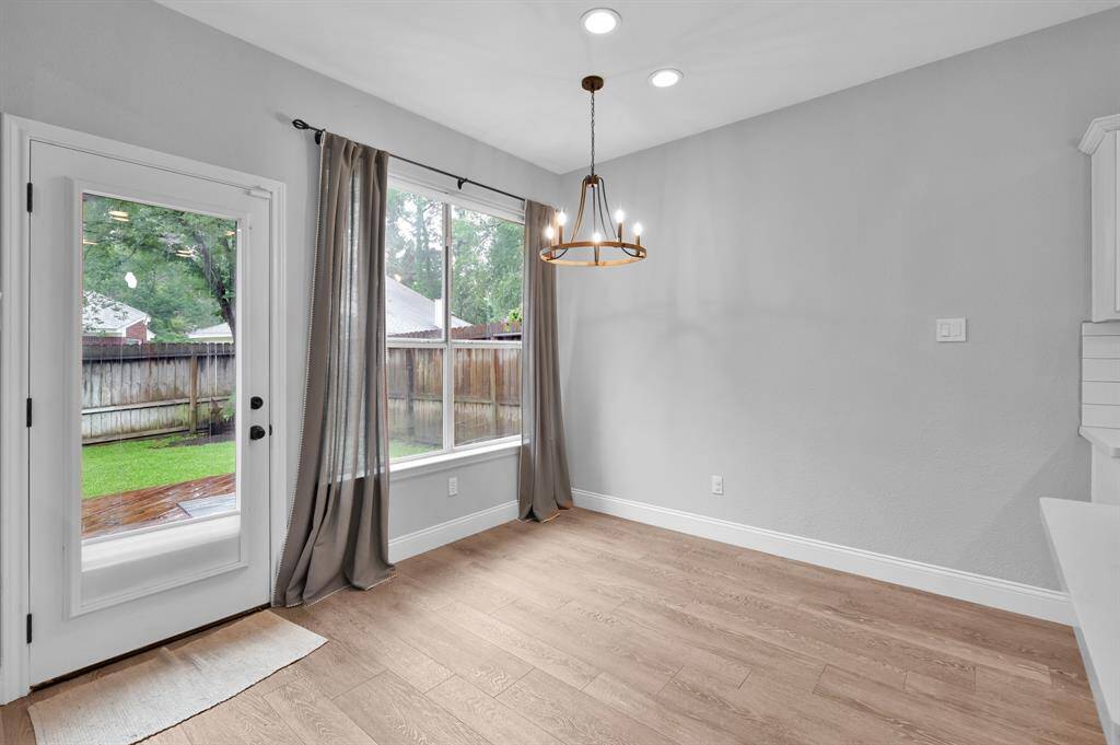 Enjoy backyard views from the breakfast room, highlighted by an updated light fixture.