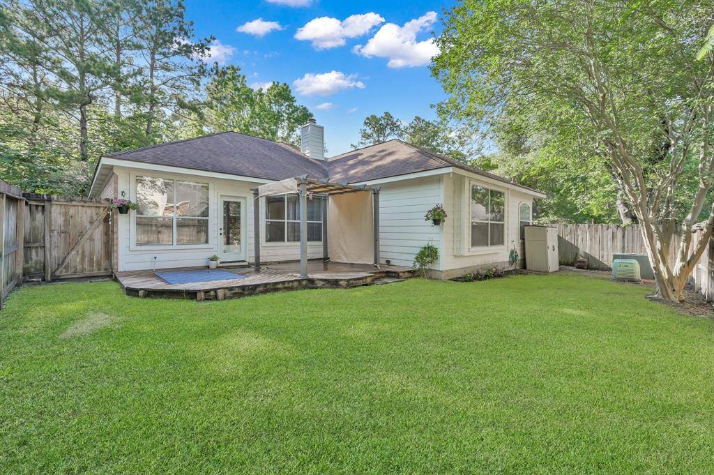 The backyard offers grassy space for kids and pets to play, and includes a storage shed that stays with the home.