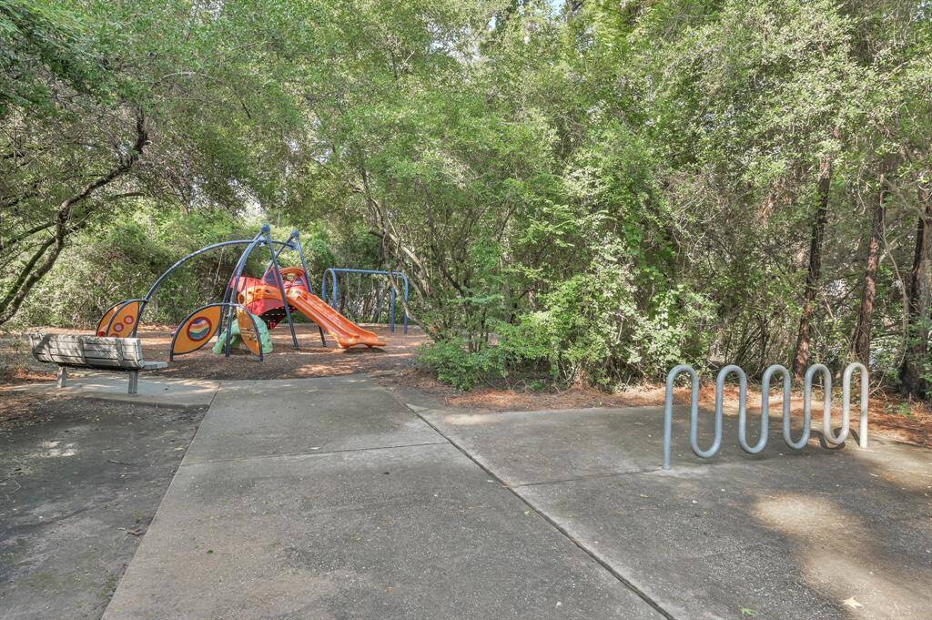 Hollylaurel Park provides a nearby green space and connects to The Woodlands Greenbelts for miles of walking trails.