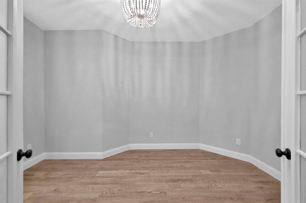 Just off the entryway, a private room with double doors offers endless possibilities—perfect as a home office or flex space to fit your family's needs.