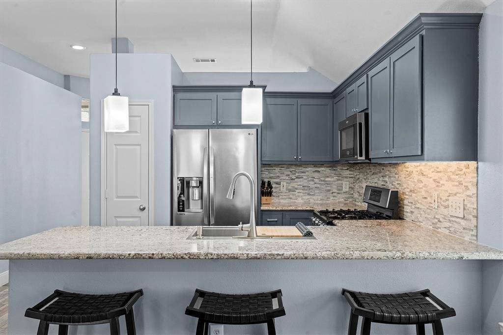 breakfast bar area with seating for 4+