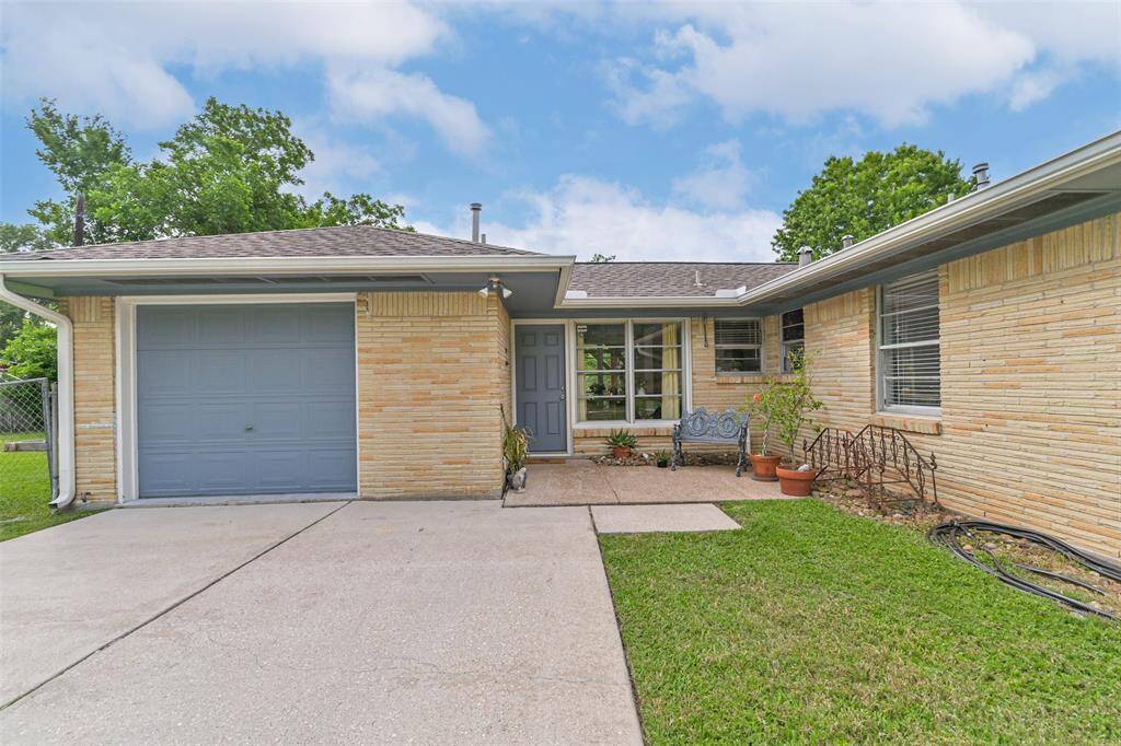 Notice the side attractive paint and patio leading to the side entrance to the home