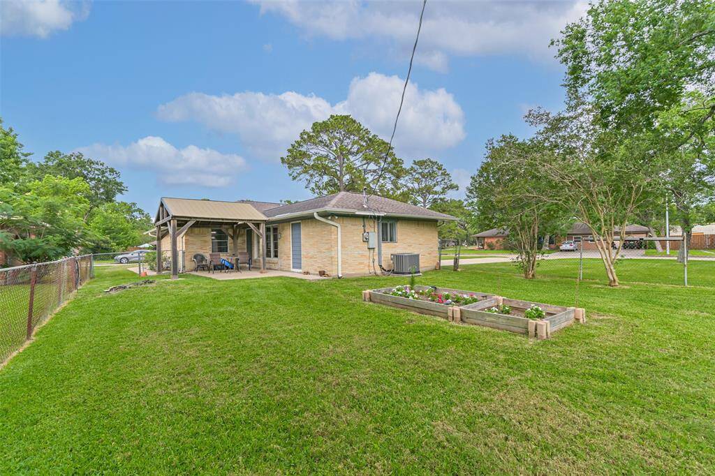 Take advantage of this spacious yard with ample room for entertaining, for kids to run & play and a game of cornhole or horseshoes or even some gardening in the raised beds. The pavilion provides a retreat from the sun