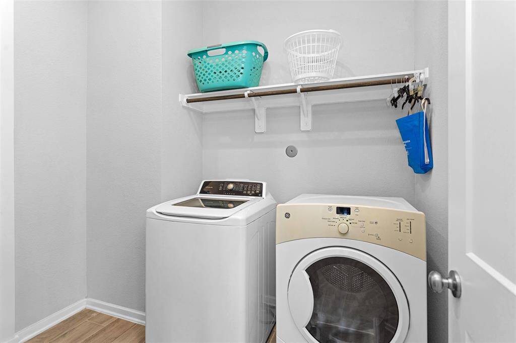 It does not show but the convenient utility room, located inside the home, connects directly to the primary suite for added ease