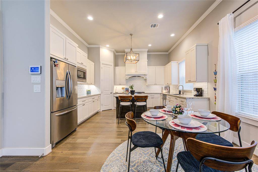 Charming and light-filled breakfast room just off the kitchen, offering the perfect spot for casual dining.