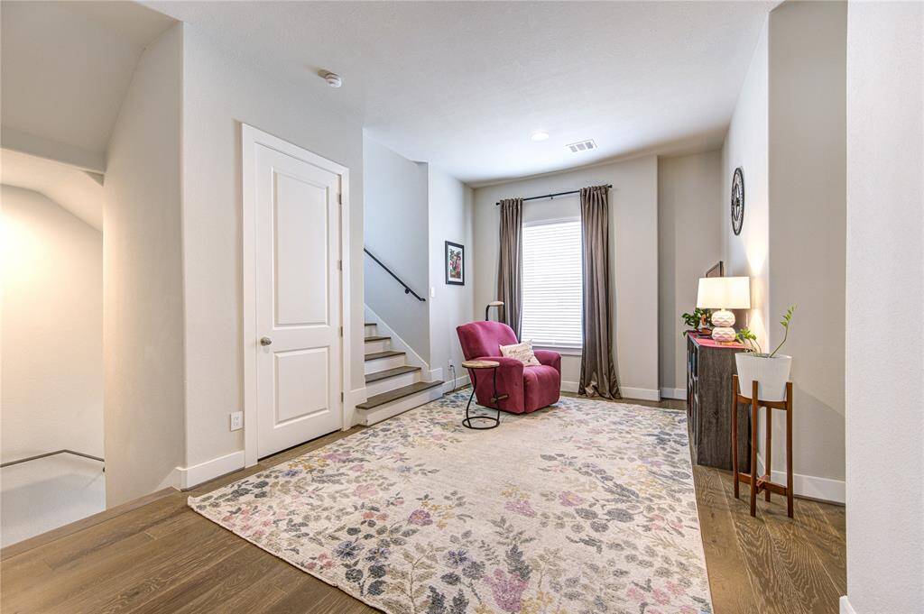 Spacious and versatile second-floor landing that can easily function as a game room, sitting area, or additional workspace. Featuring French Oak hardwood floors, recessed lighting, and open sightlines, this flexible space adds valuable square footage and can be customized to suit your lifestyle. Perfect for relaxing, entertaining, or setting up a cozy reading nook.