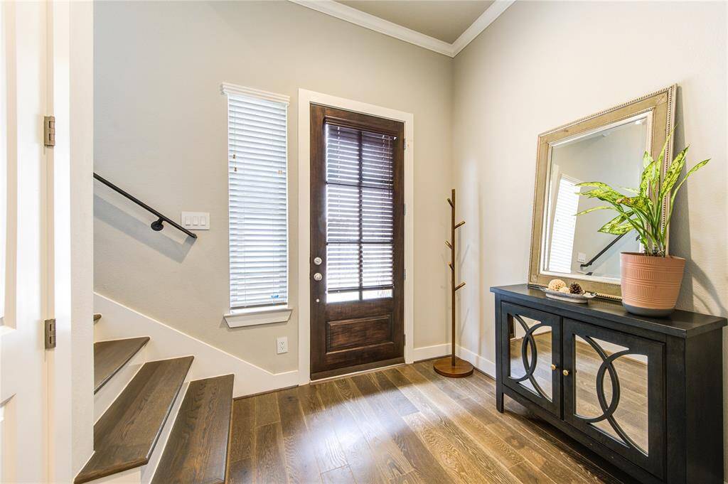 Welcoming foyer with soaring ceilings and stunning French Oak hardwood floors that continue throughout the home-no carpet!