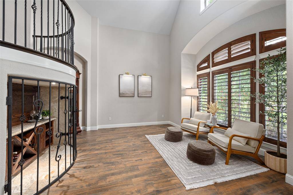 Formal Living room is just off the entryway ..and features a wine/adult beverage custom storage with a security gate if you need to lock up the beverages.  Could be a great music room, wine room, and many other possible uses.