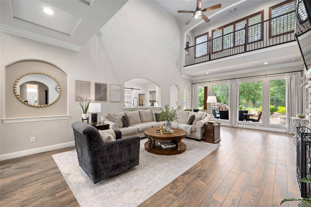 WOW...what a view of the Family Room! High Ceiling, fresh neutral designer paint, and so much natural lighting pouring into this room will ushers in the feeling of grandness and warmth at the same time!