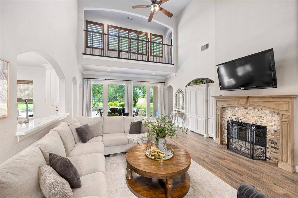 Fire place is a great focal point of this spacious and bright room!