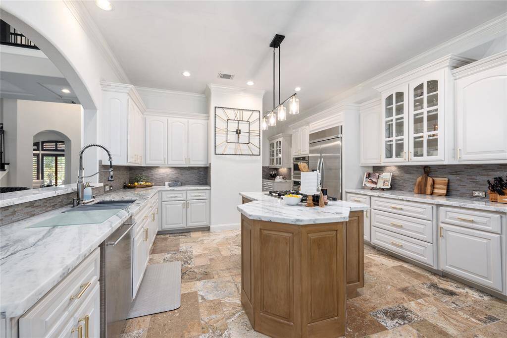 Tons of prep space on these countertops, as well as a great amount of storage available in these updated cabinets.