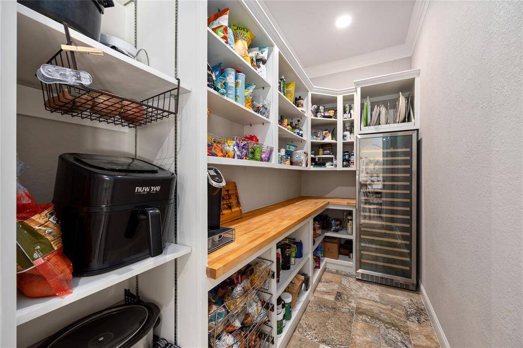 One of the most useful features of this home is this custom designed walk in oversized pantry! Buy ALL the Costco items your hearts desires...there room for it here!