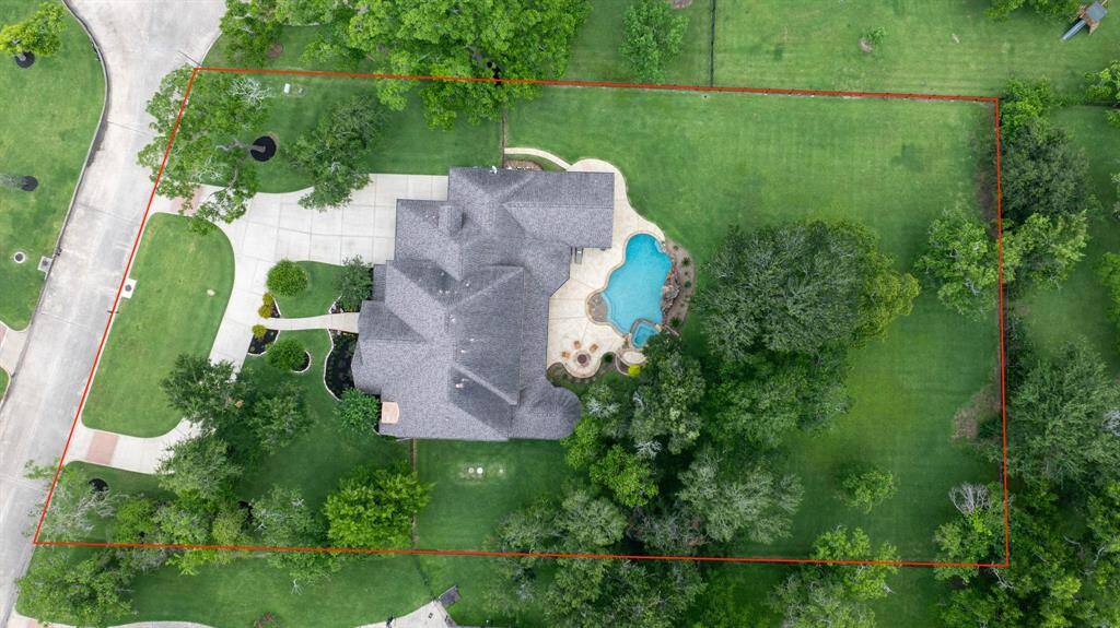 Spacious even describes the Driveway...with this home offering a circle and oversized driveway leading into a 4 car tandem garage!