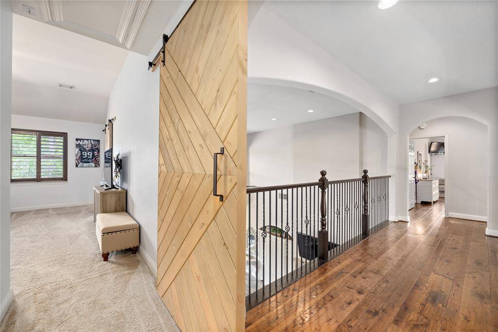 View of the handsome sliding barn door custom made just for this space!
