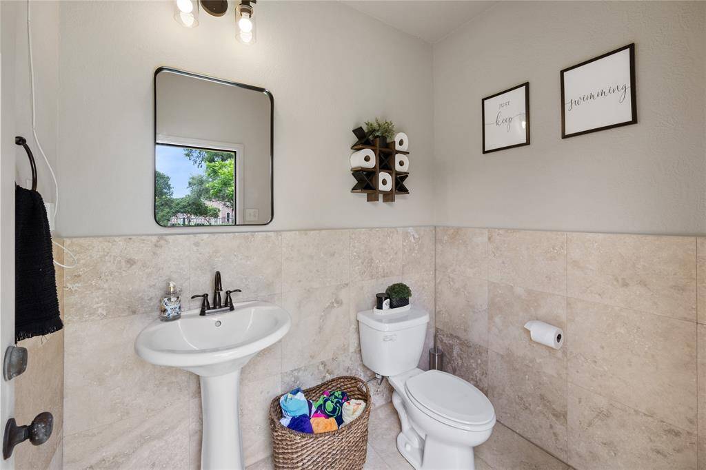 Just around the corner from the covered outdoor kitchen is this super useful bathroom...there is even a shower just outside to wash off the chlorine!