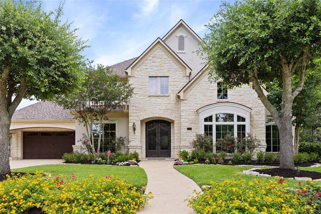 Notice the HANDSOME Curb Appeal highlighted by the professional landscaping, meticulously trimmed and shaped mature trees, and stately Stone and Stucco elevation!