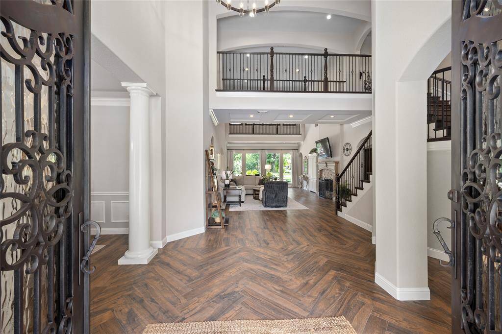 Intricate Double Iron front doors initiates the luxurious feel to the home!