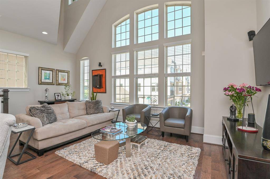 Spacious family/living area provides many options for your furnishings. High cathedral ceilings, floor-to-ceiling windows and natural wood flooring add to its beauty.