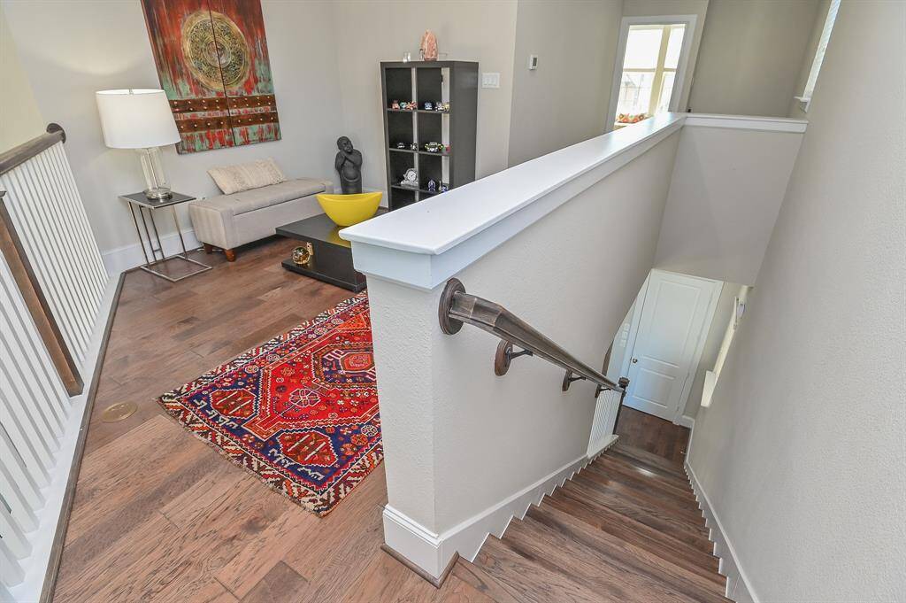 Another view of the rustic, oval bathtub, right below retro window panes.