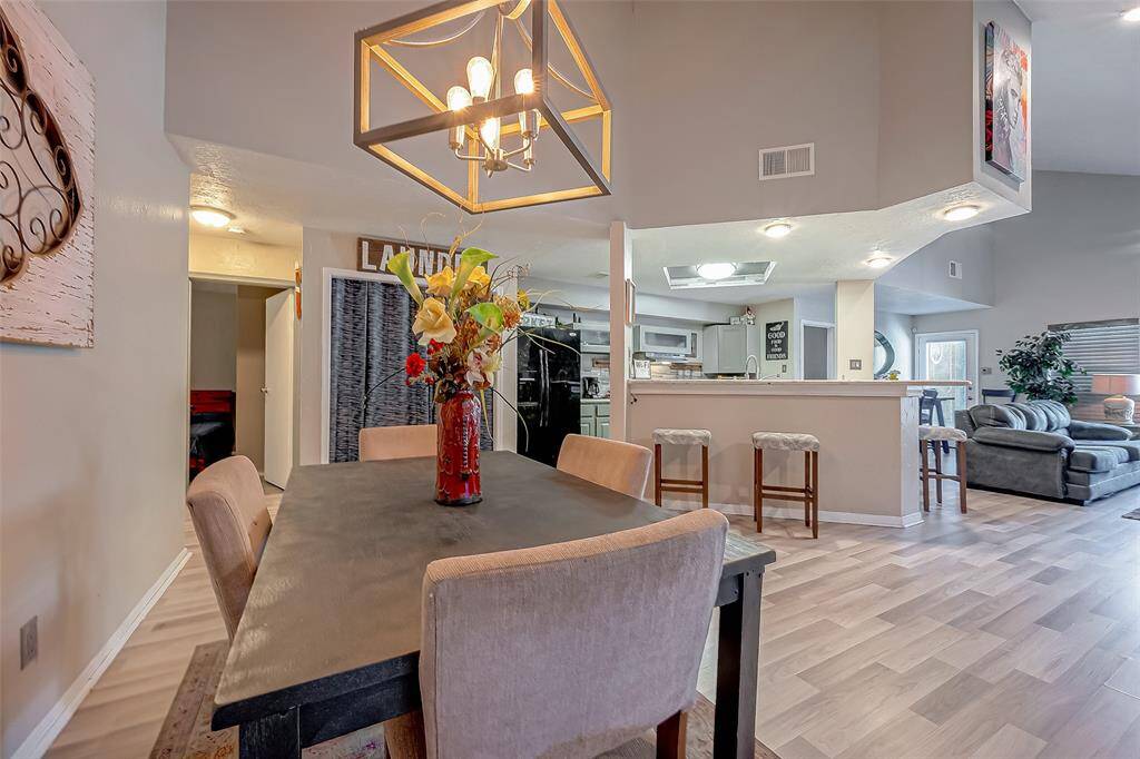 Alternate view of the dining area looking into the kitchen.