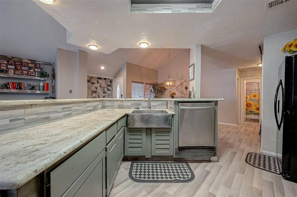 Granite counter tops with ample cabinetry.