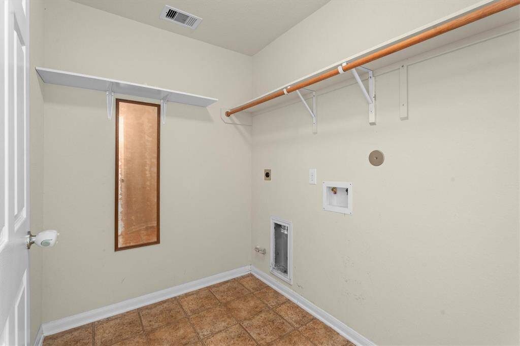 large in house laundry with freezer space