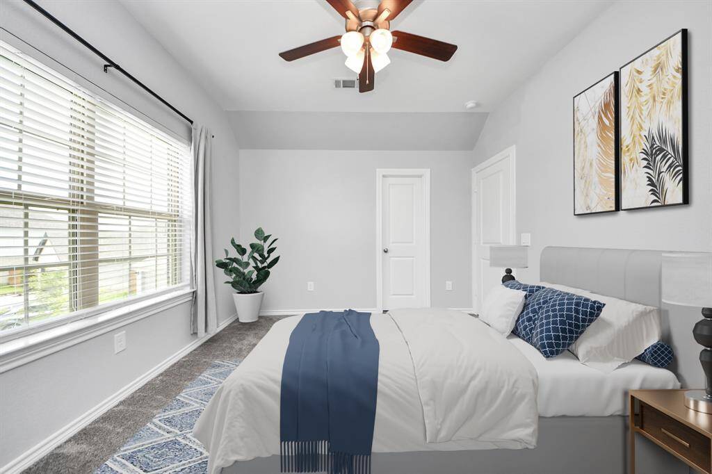 Generous outdoor living space under a covered patio, overlooking the private pool and fenced yard.