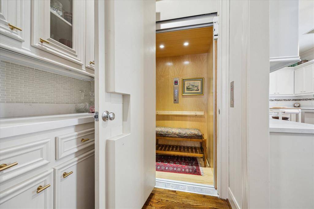 Door to the elevator is accessible from the dry bar.