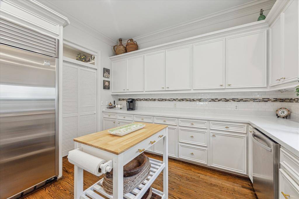 Well-appointed kitchen with generous countertops and extensive storage throughout.