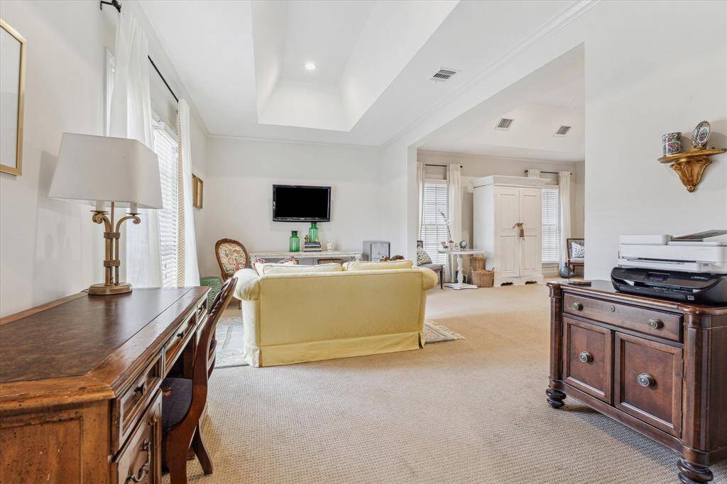 Flexible area off the primary suite offers many possibilities: office, tv room, workout space, and more.