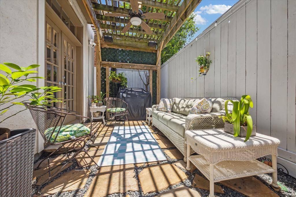 Private back patio with grill and built-in speakers.