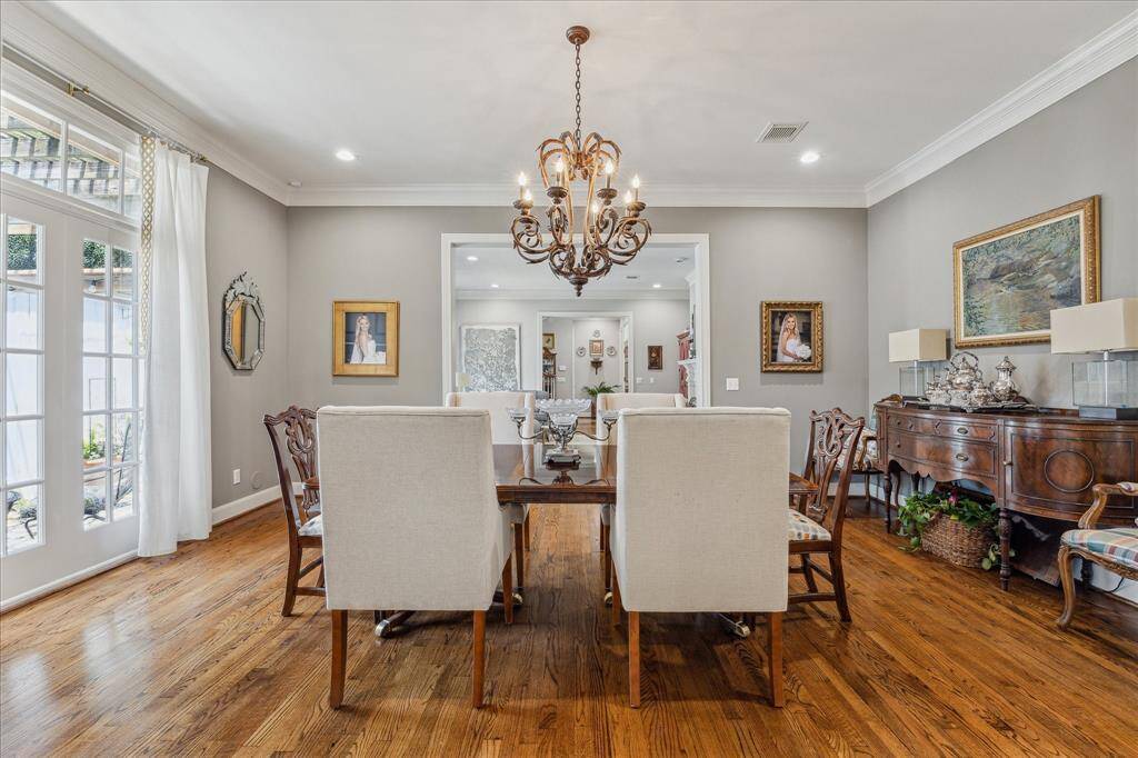 Elegant and generously-sized dining room, perfect for large furnishings and entertaining guests.